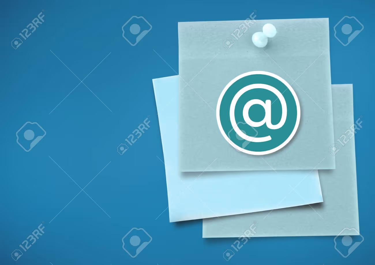 Digital composite of Sticky Note with At Icon against neutral blue background - 72223414 Digital composite of Sticky Note with At Icon against neutral blue background - 72223414