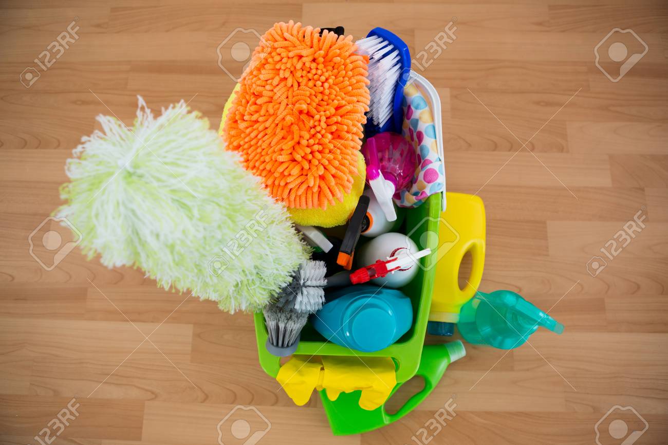 High Angle View Of Duster And Cleaning Equipment In Bucket On