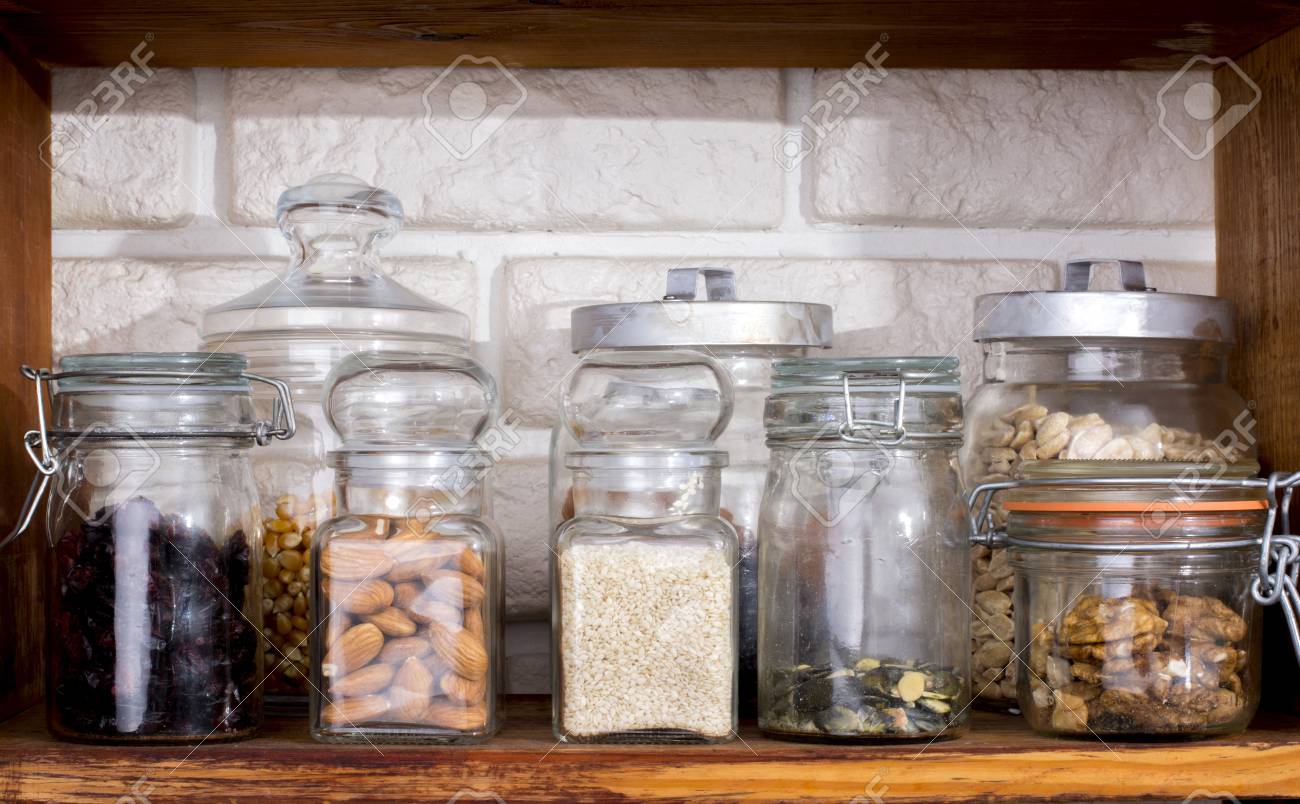 Jars with dried fruits and nuts on shelf - 60069969 Jars with dried fruits and nuts on shelf - 60069969