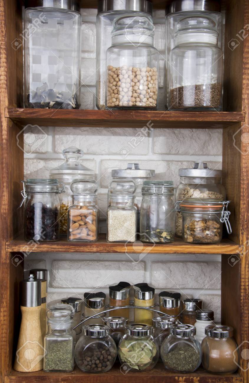 Jars with nuts, dried fruits, spices, herbs and others on kitchen shelves - 60070017 Jars with nuts, dried fruits, spices, herbs and others on kitchen shelves - 60070017
