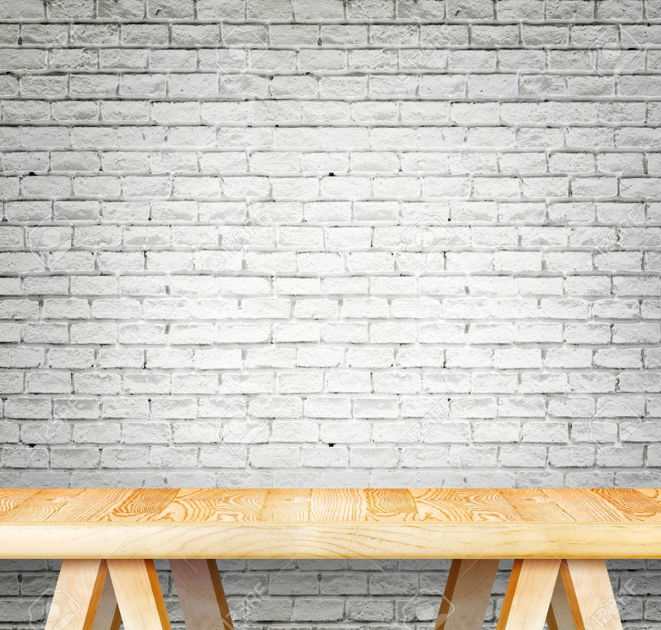 blank modern wooden table with leg at white brick wall template