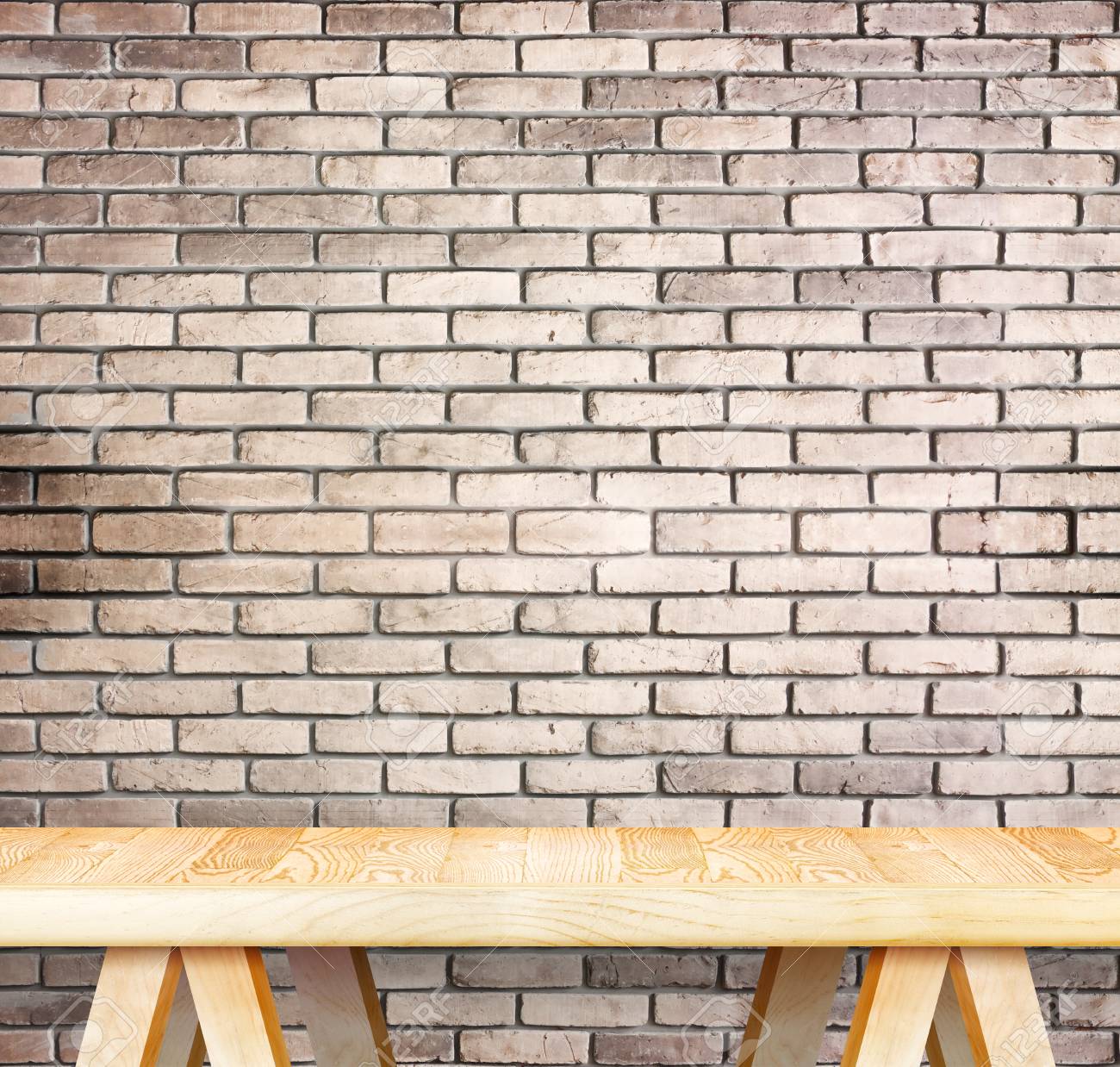 blank modern wooden table with leg at red brick wall template