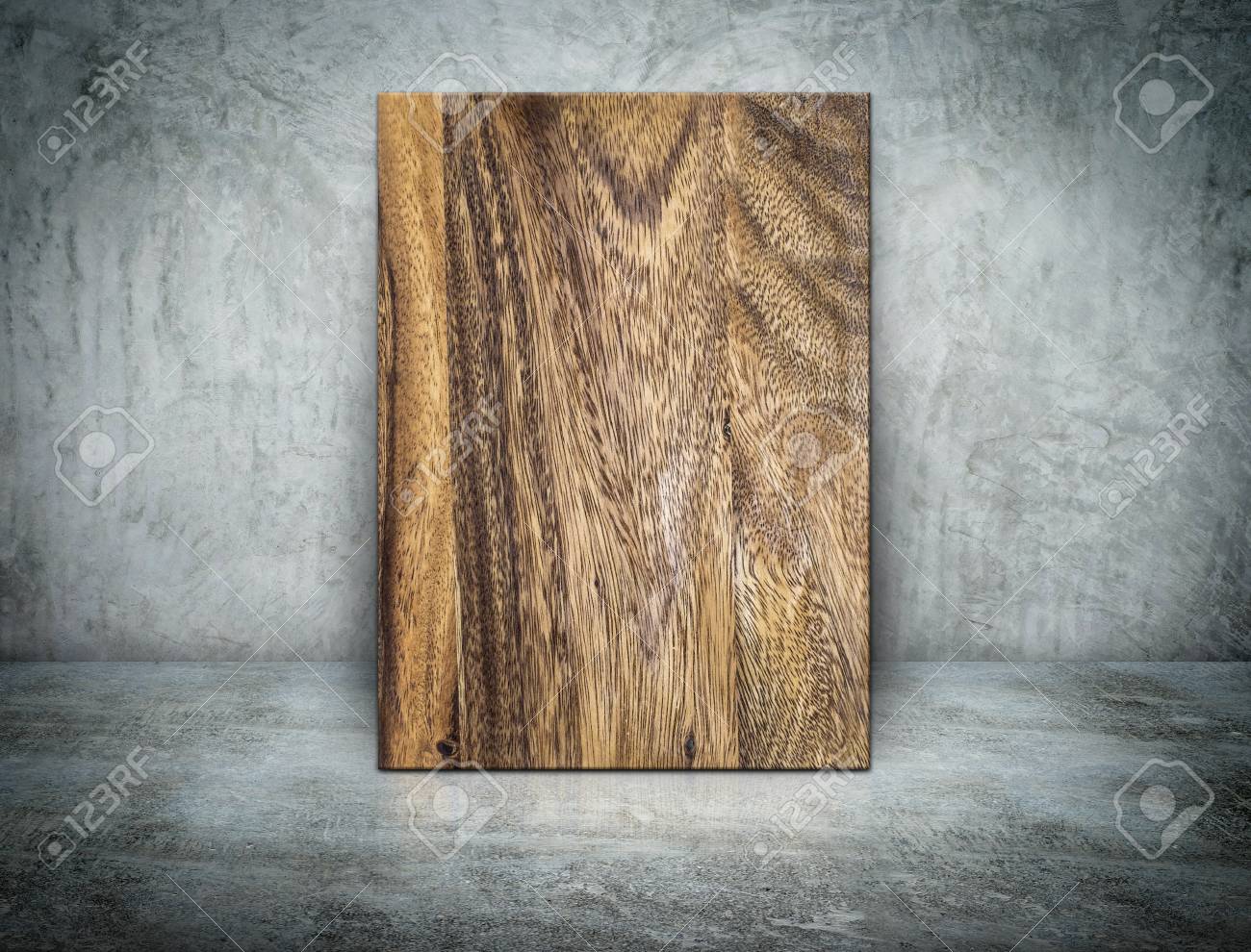 Blank Wood Block Frame Leaning At Grunge Grey Concrete Wall And