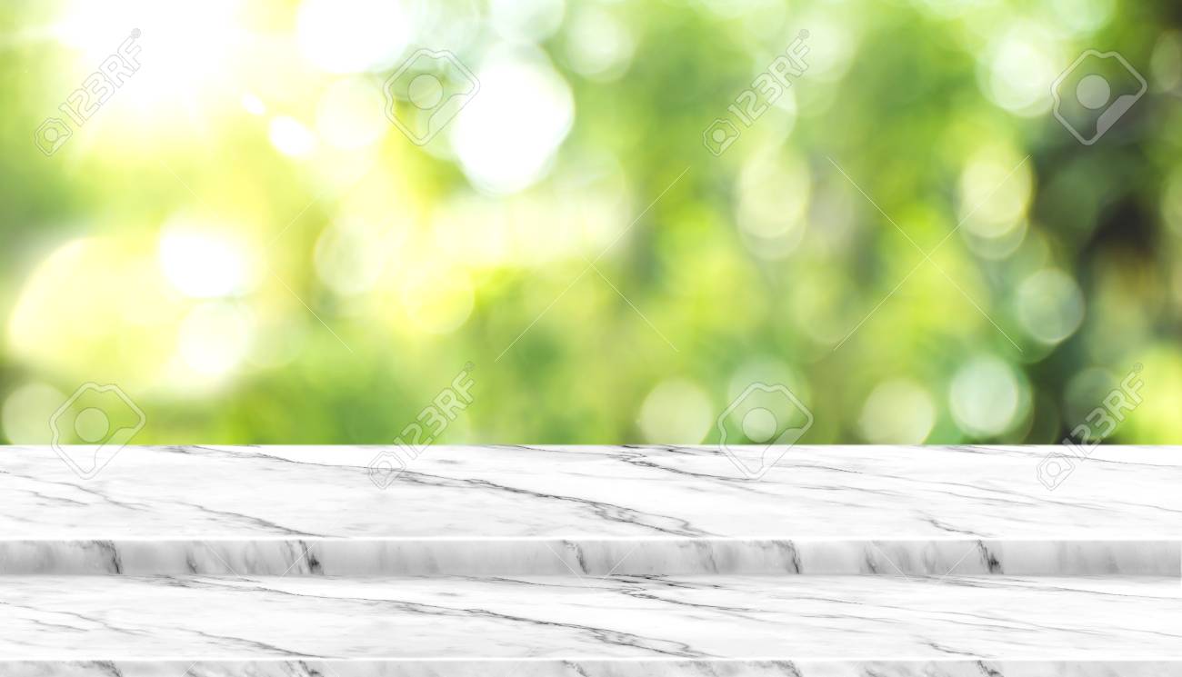 Empty white marble table top with blur tree in park with bokeh light at background,Mock up template for display of your design,Banner for advertise of product,panorama view. - 116064946 Empty white marble table top with blur tree in park with bokeh light at background,Mock up template for display of your design,Banner for advertise of product,panorama view. - 116064946