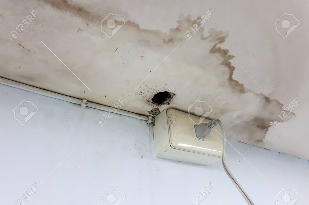Water Leaking From The Roof Damaging The Ceiling And Causing