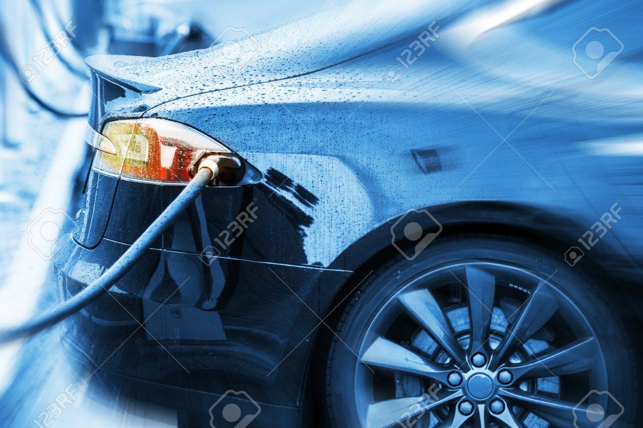 Zero Emission Electric Car in Charging Station. Modern Electric Sedan Car Concept Photo. - 62488392 Zero Emission Electric Car in Charging Station. Modern Electric Sedan Car Concept Photo. - 62488392