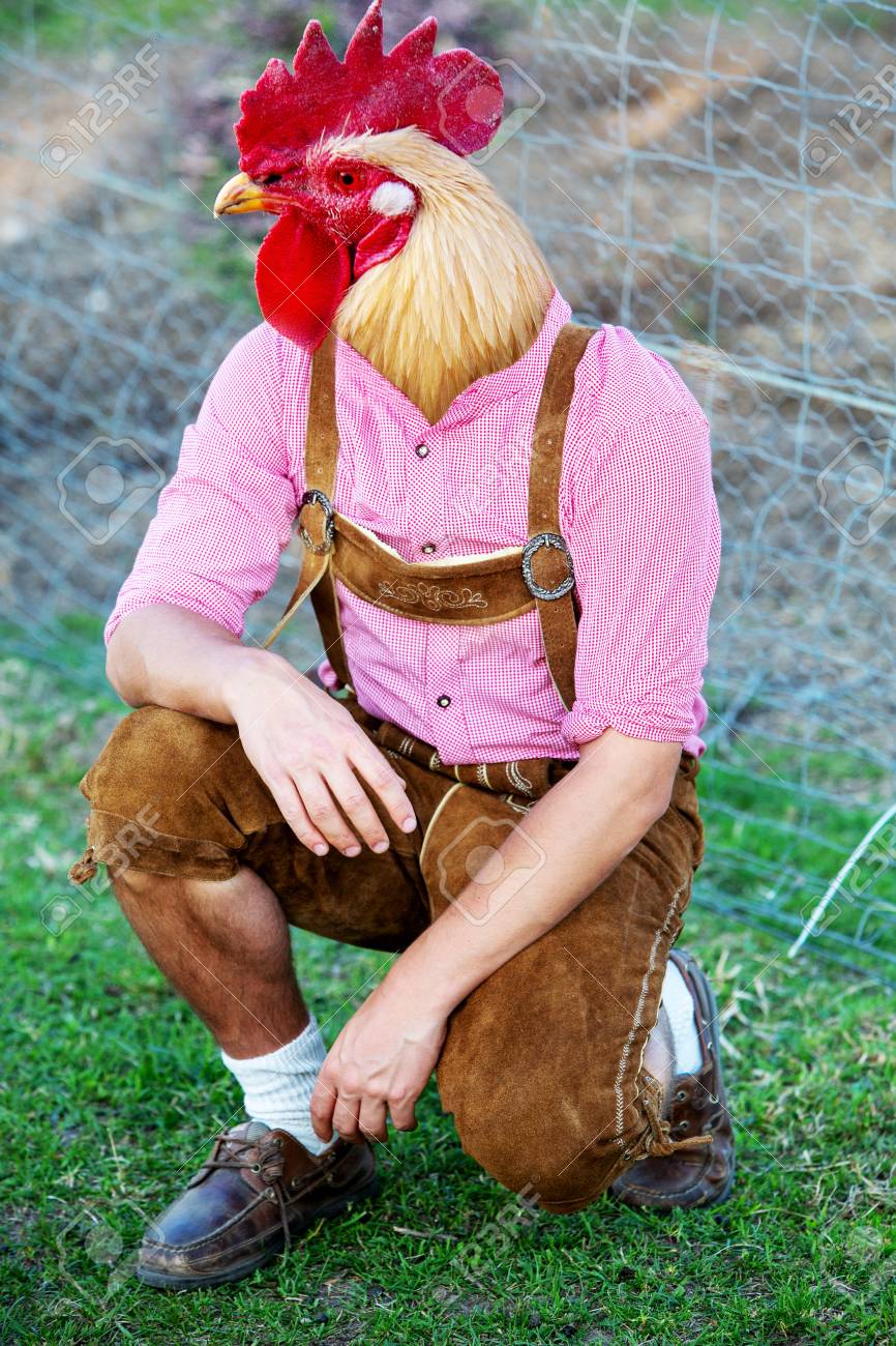 101287698-bavarian-man-with-a-chicken-head-kneeling-outdoors.jpg