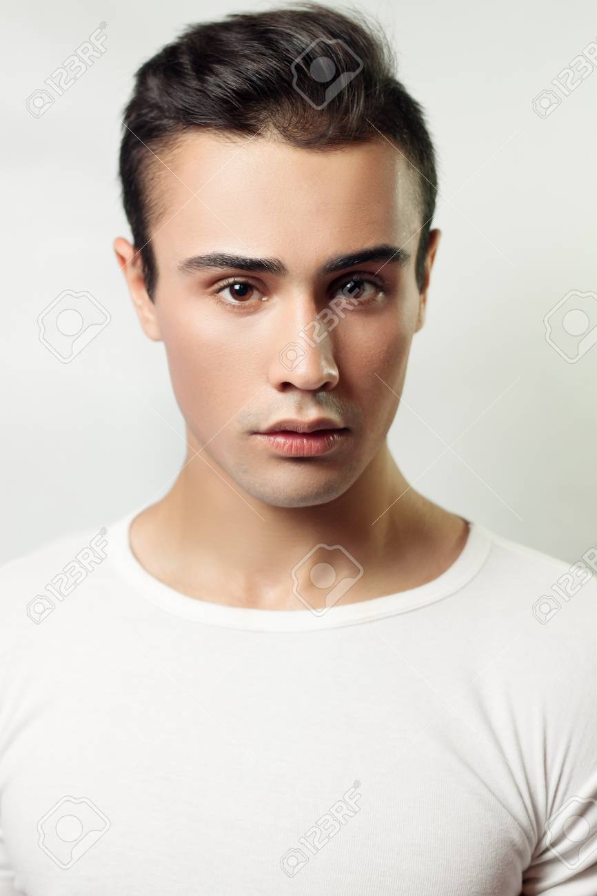 Handsome Young Man Portrait. Brunette Guy In White T-shirt On A Light  Background Used, Clean Skin, Studio Shot, Beauty Stock Photo, Picture and  Royalty Free Image. Image 51928072., image size:866x1300
