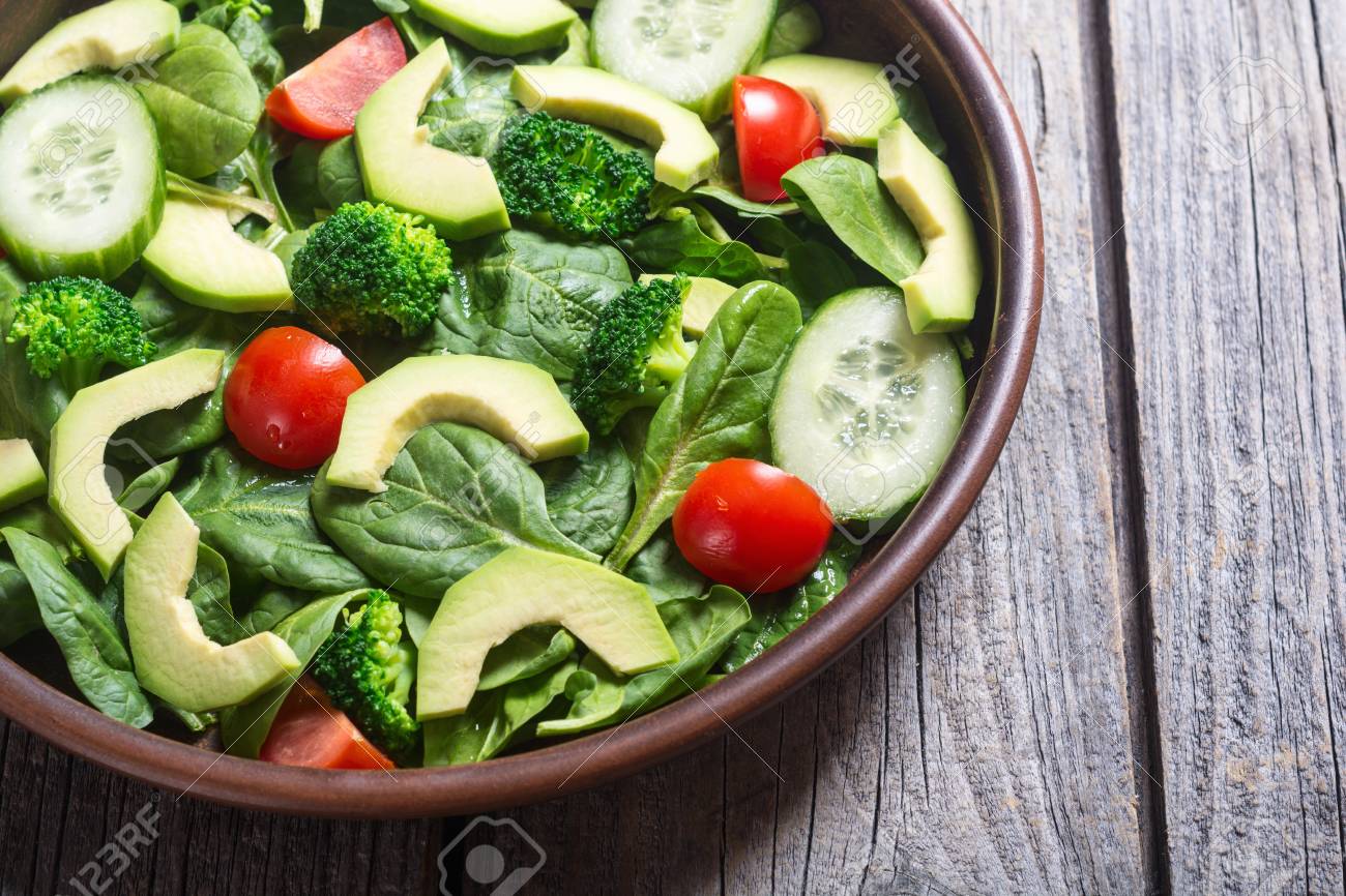 Avocado Salad With Tomatoes Cucumber Broccoli And Spinach Stock Photo Picture And Royalty Free Image Image 97727483