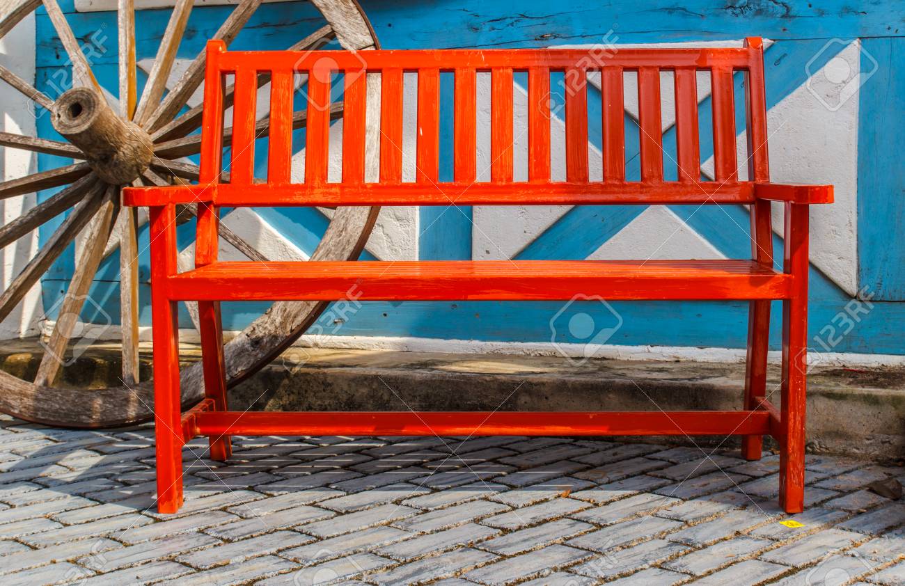 red wooden bench vintage style a background stock photo picture