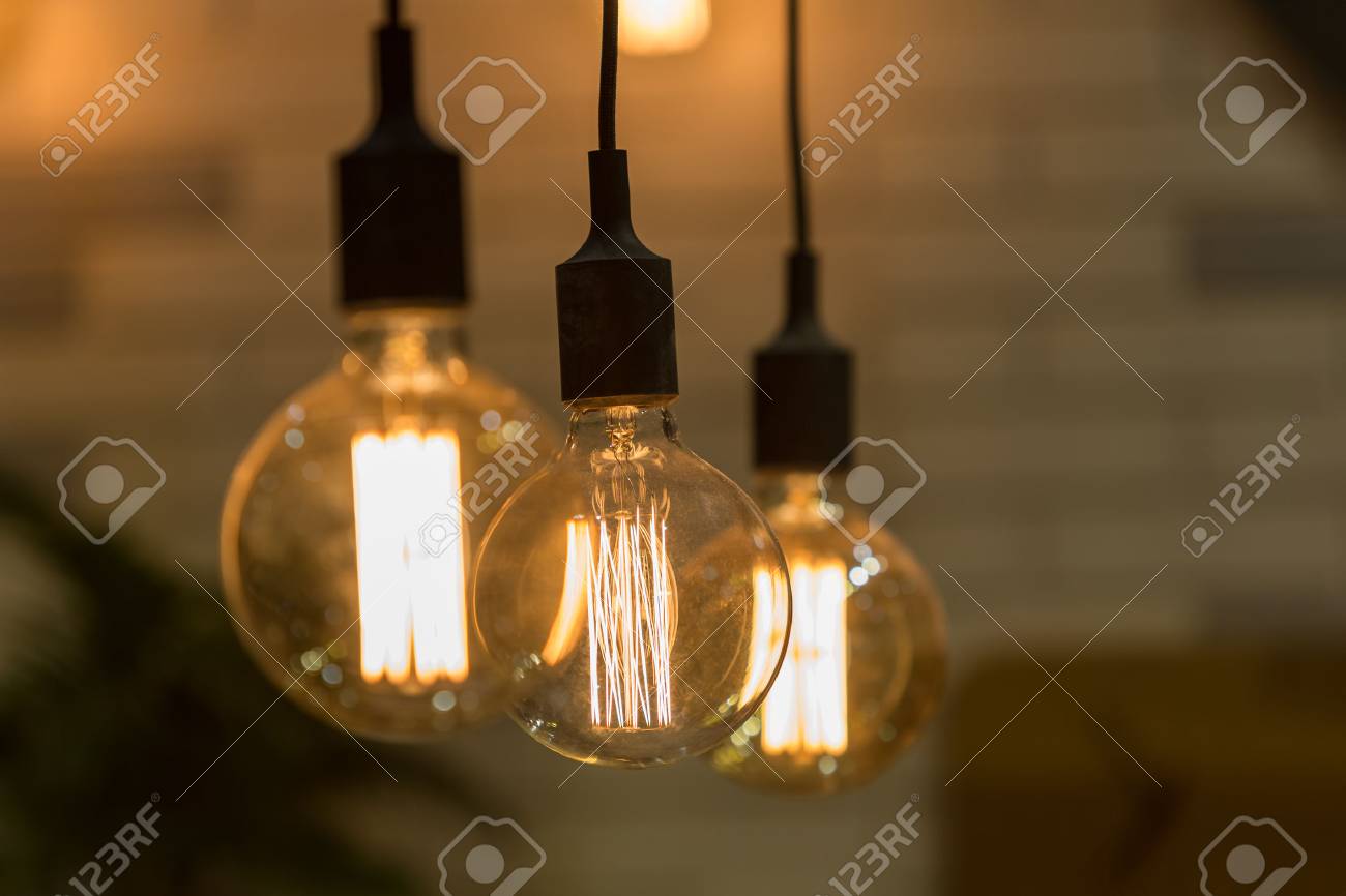 vintage style light bulbs hang and decorated in a living room stock