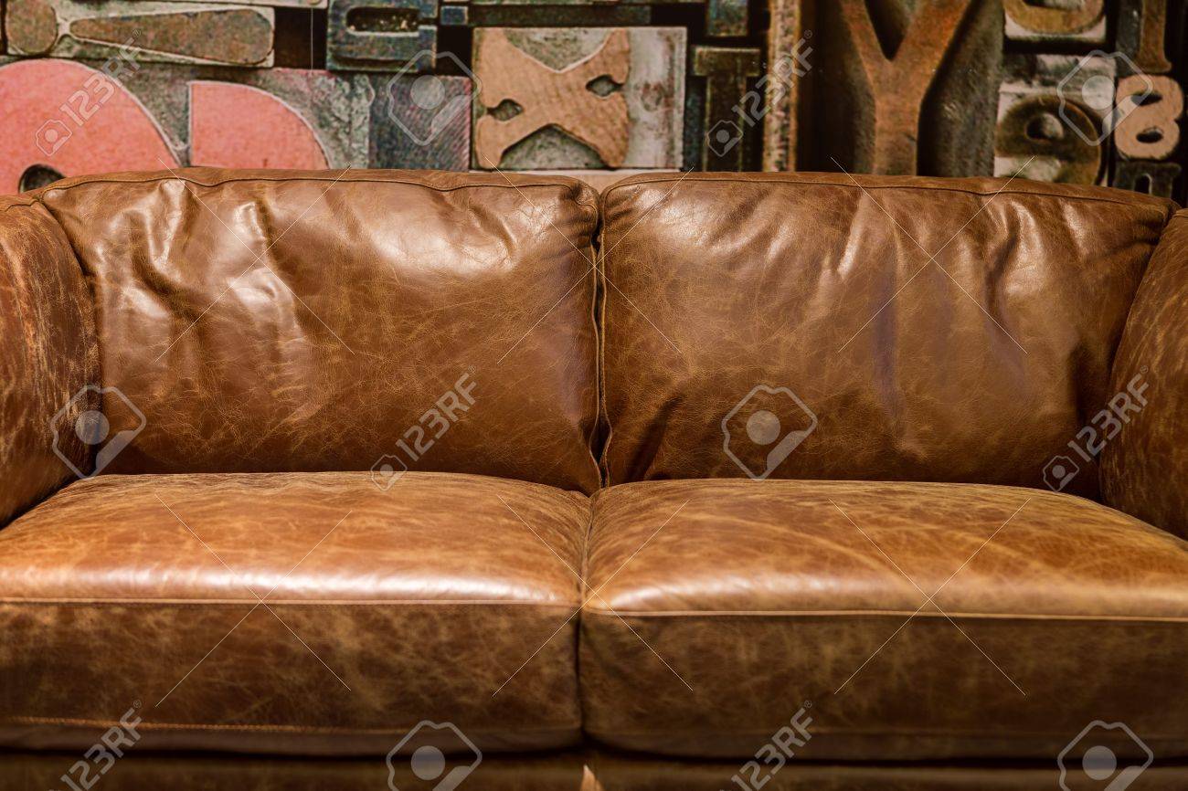 Vintage Brown Leather Sofa In A Modern Living Room