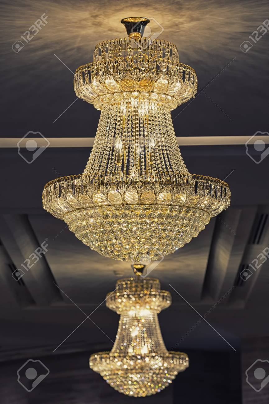 Beautiful Crystal Chandelier Hang From White Ceiling On A Dark