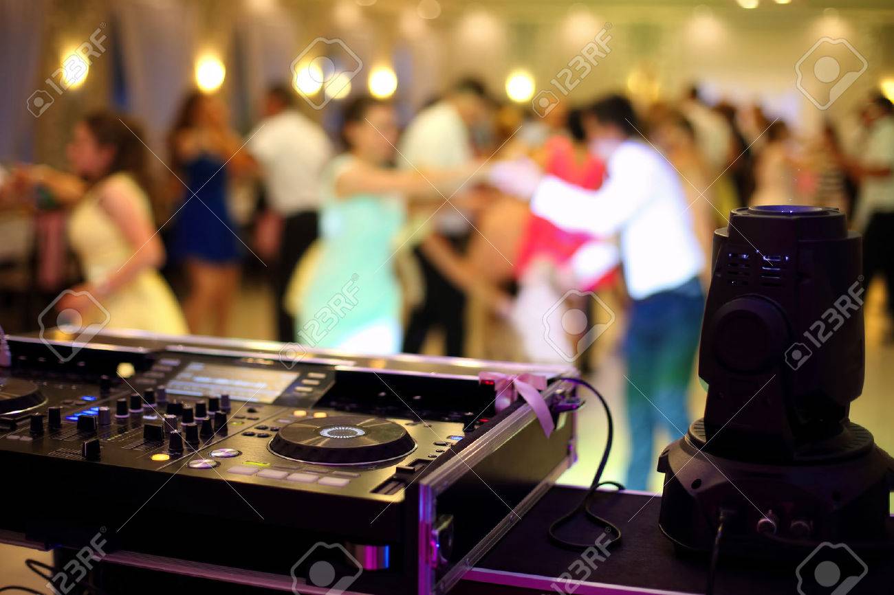 Dancing couples during party or wedding celebration by dj mixer - 64225529 Dancing couples during party or wedding celebration by dj mixer - 64225529