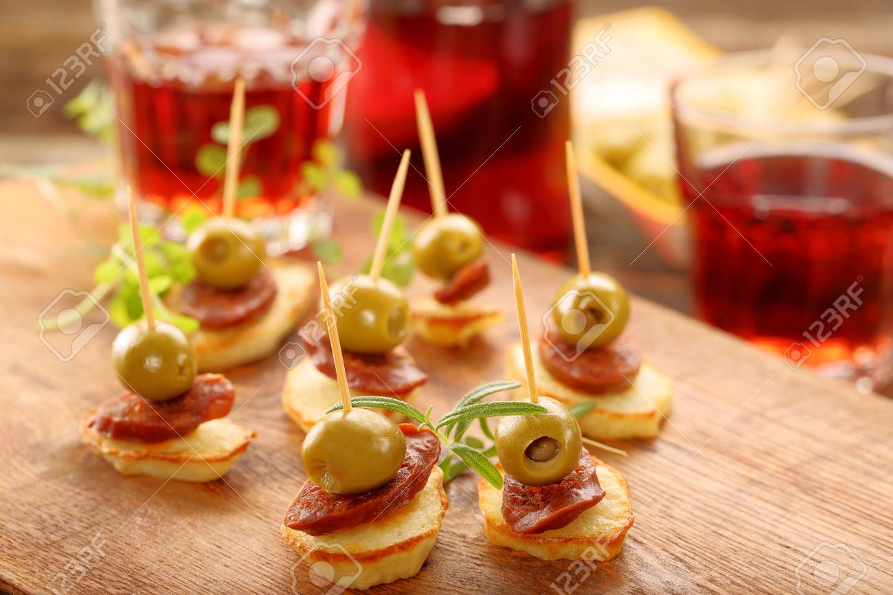baked potatoes spanish snack with sausage chorizo and green olive