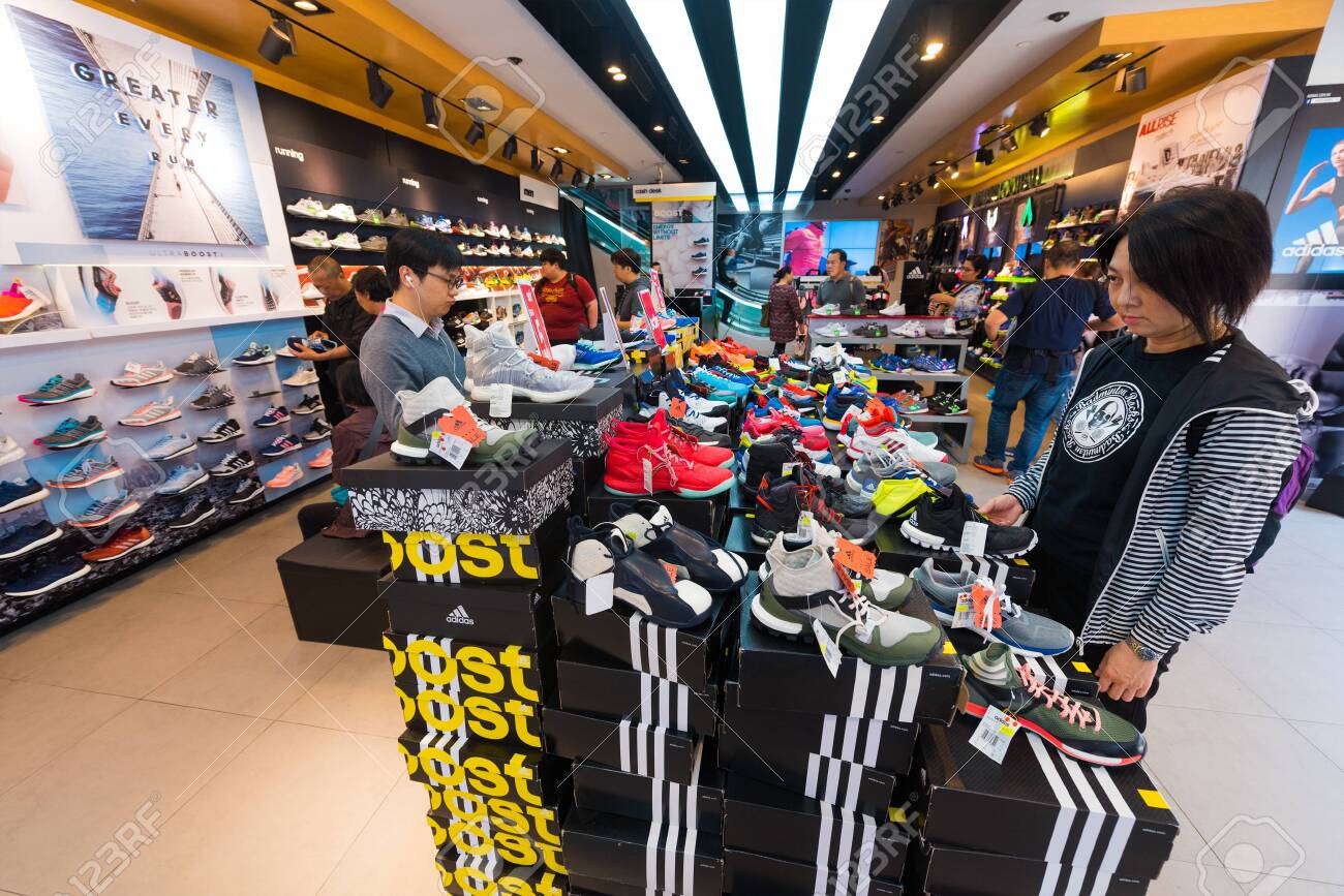 Afgeschaft Verkoper Chip HONG KONG - MARCH 20, 2017: People Buy Shoes At Adidas Store In Tsim Sha  Tsui. Adidas