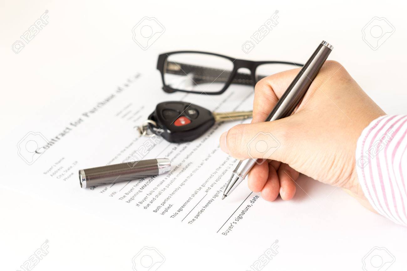 man signing a car purchase contract on white stock photo picture car purchase contract