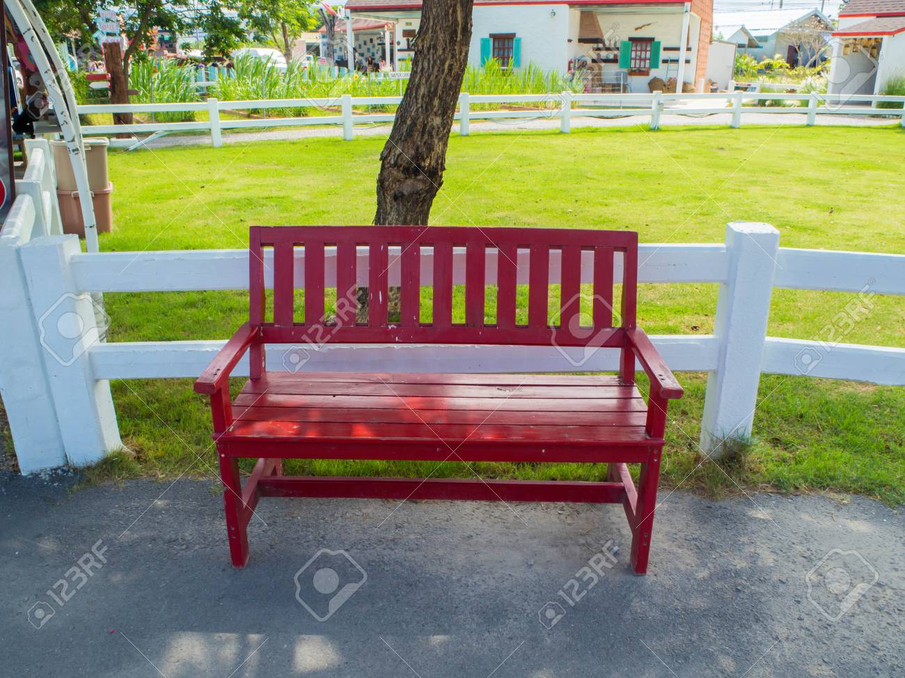 red wooden bench in the park area stock photo picture and royalty