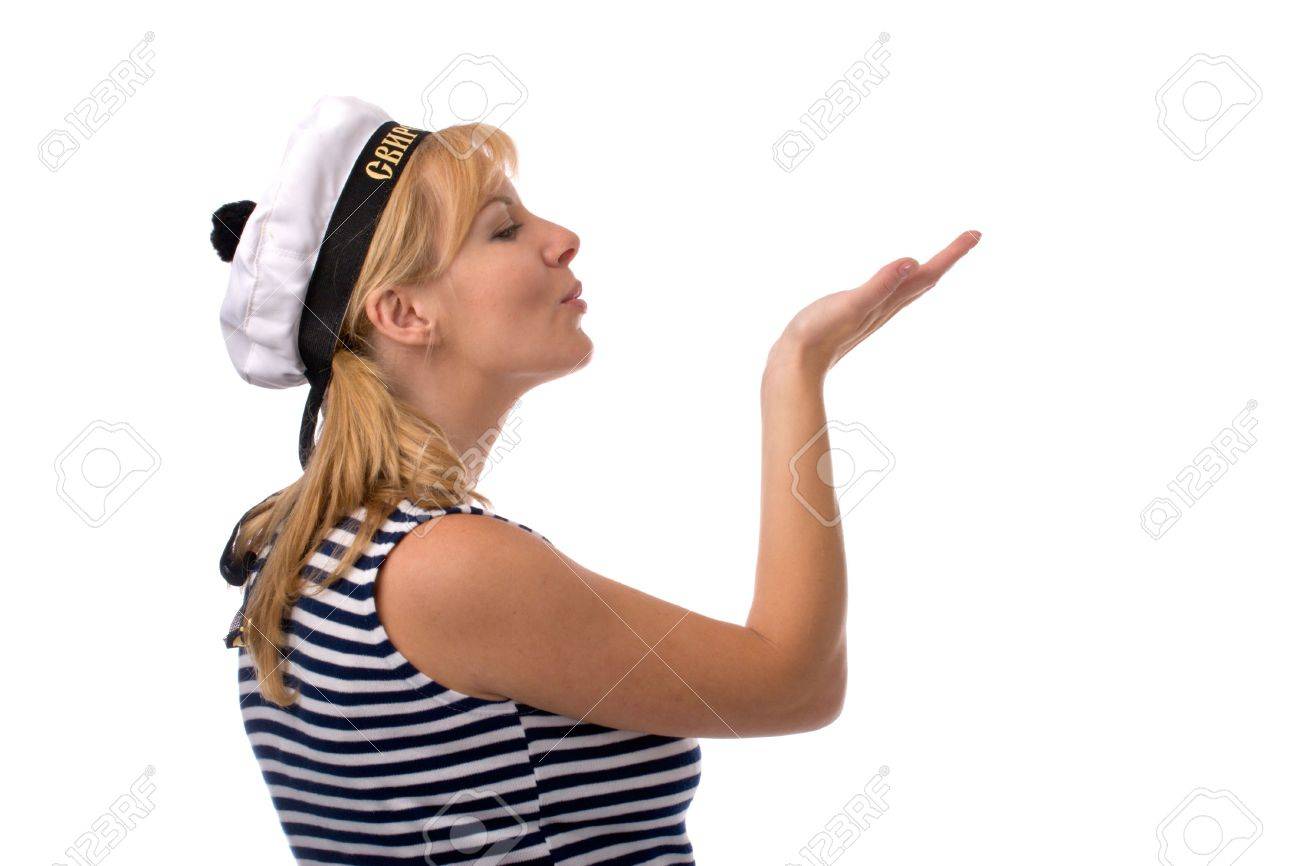 ロシア美少女戦士セーラー服白で隔離され 幸運の願いと彼女の手のひらに吹くで美しい女性 の写真素材 画像素材 Image