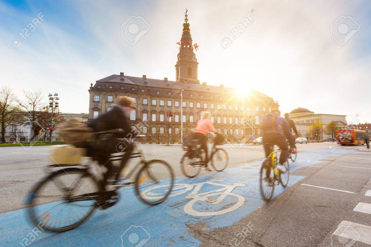 Blurred People Going By Bike In Copenhagen With Christiansborg Stock Photo Picture And Royalty Free Image Image