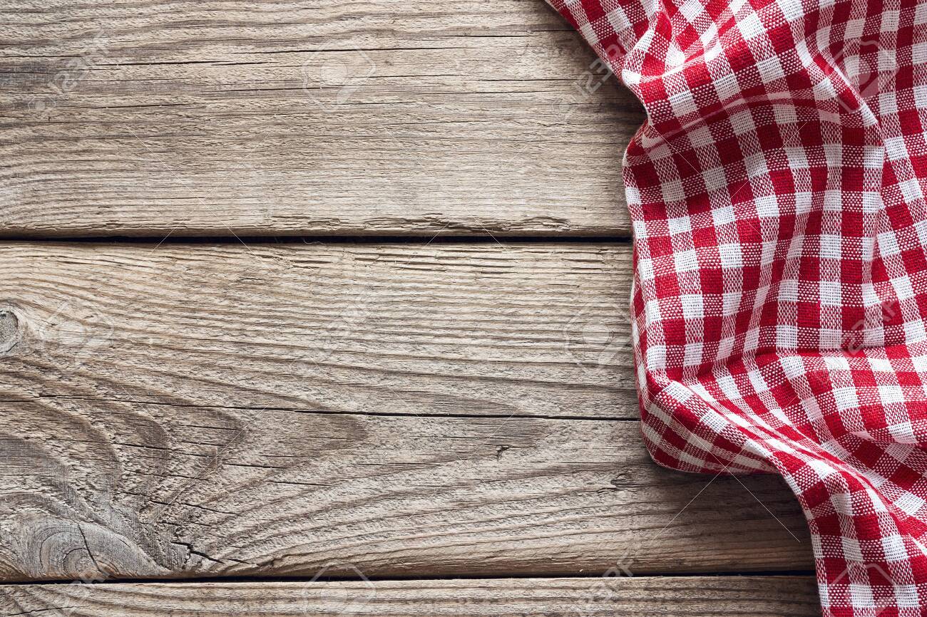 Red checkered napkin on an old wooden table. Space for text, top view. - 141434944 Red checkered napkin on an old wooden table. Space for text, top view. - 141434944