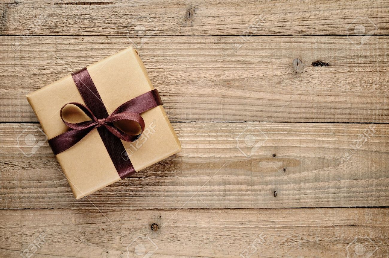 Vintage gift box with bow on wooden background - 20688738 Vintage gift box with bow on wooden background - 20688738