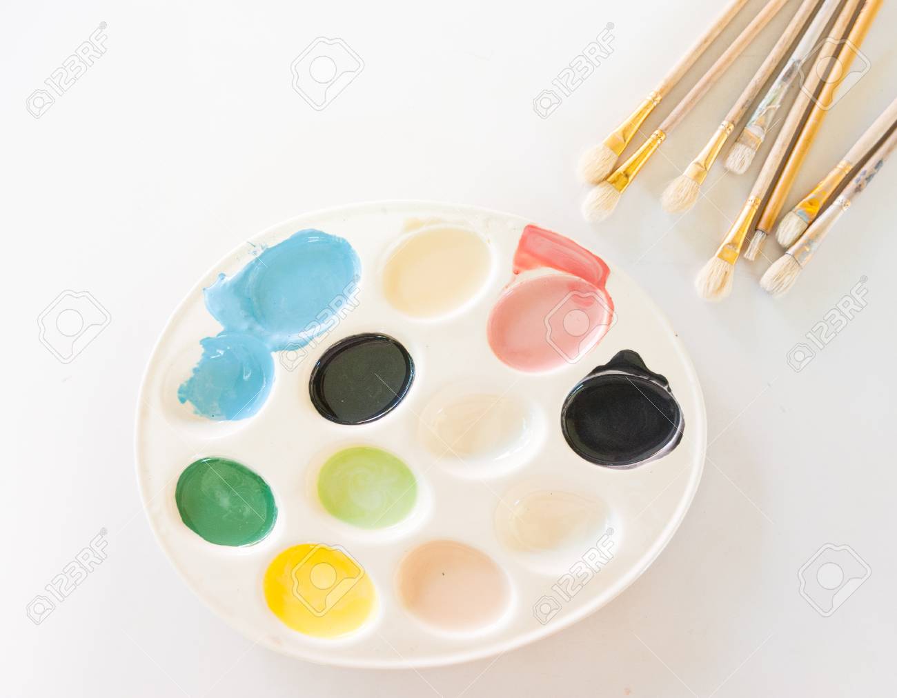 The Colorful Water Colour Plate With Brushes On White Background Stock Photo Picture And Royalty Free Image Image 92650700
