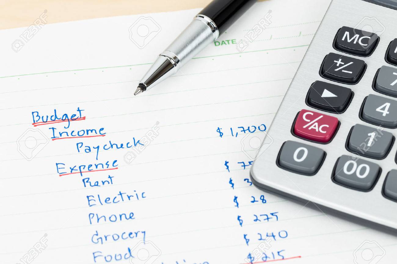 hand writing home budget with calculator stock photo picture and