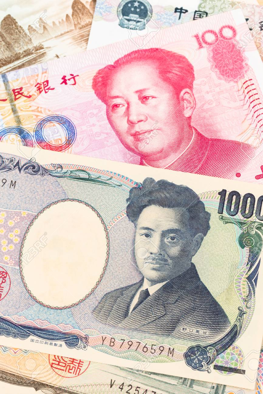 Japanese Yen And Chinese Yuan Banknote Money Stock Photo, Picture and  Royalty Free Image. Image 72111934.