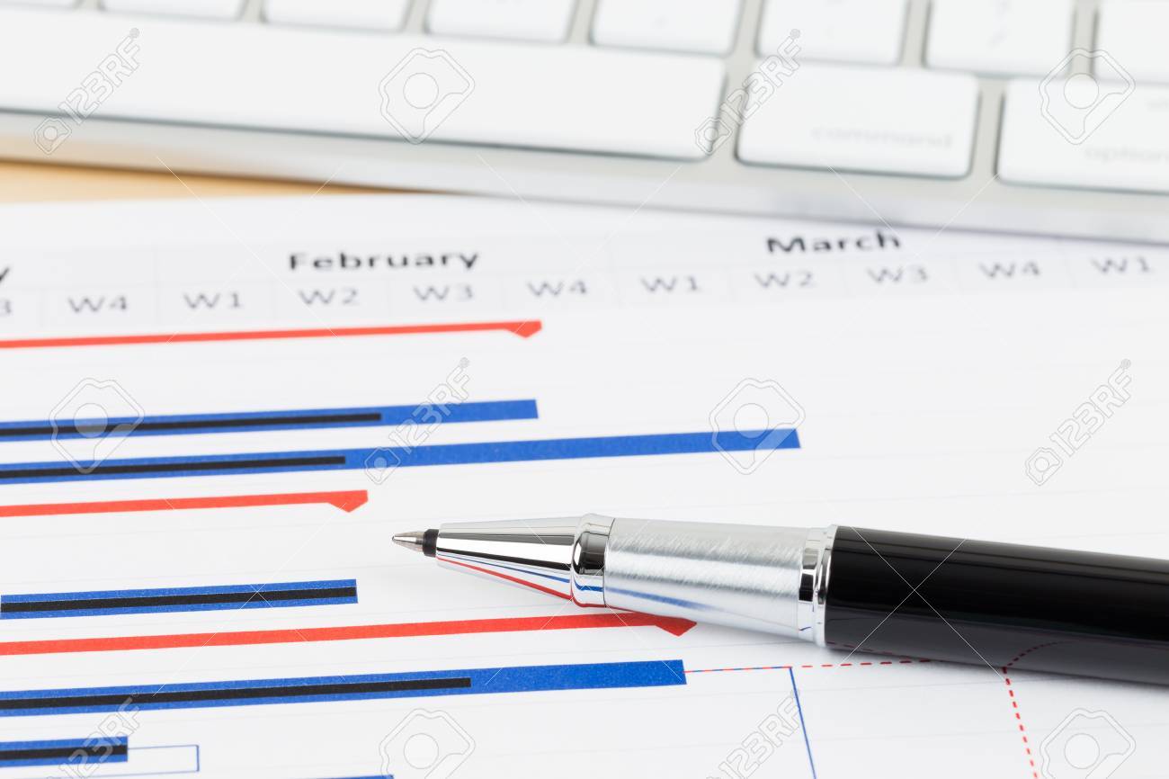 project management and gantt chart with keyboard and pen stock photo