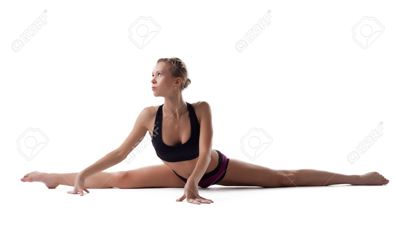 young woman in fitness costume show perfect split isolated stock