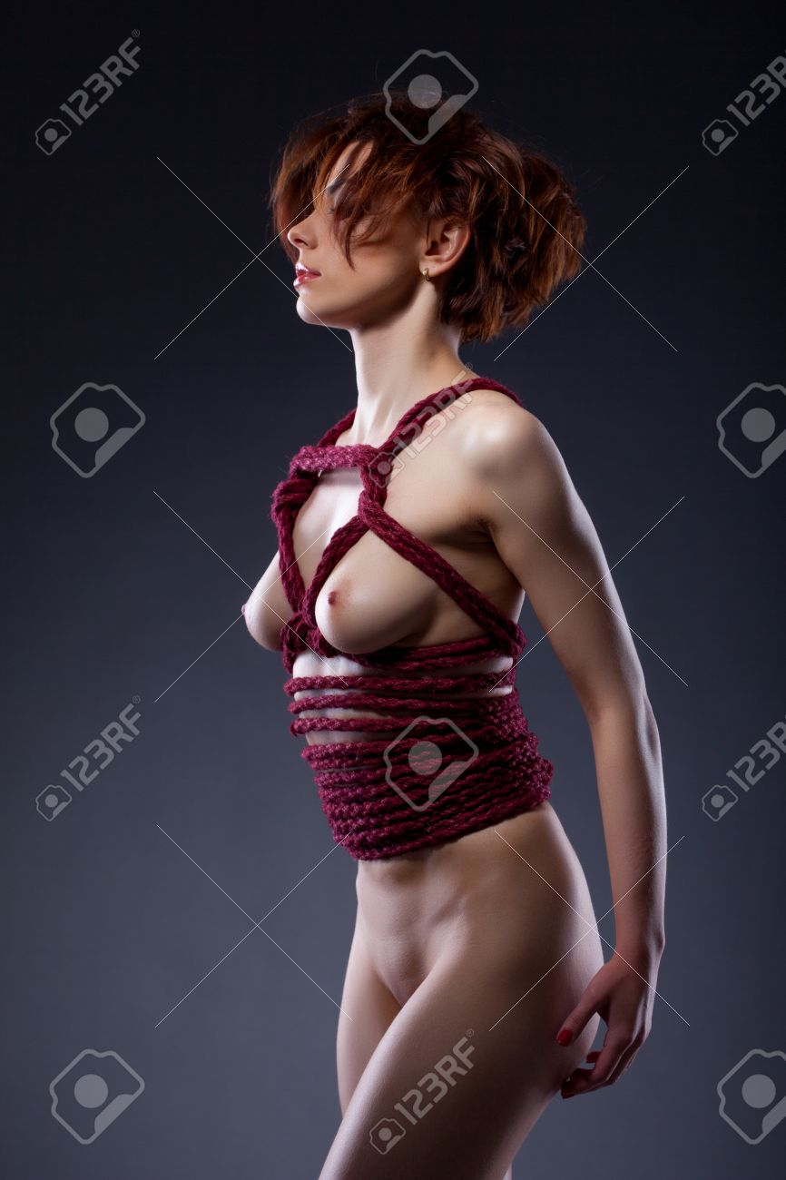 Naked Red-haired Woman Bound In Studio, Close-up Stock Photo, Picture And Royalty Free Image