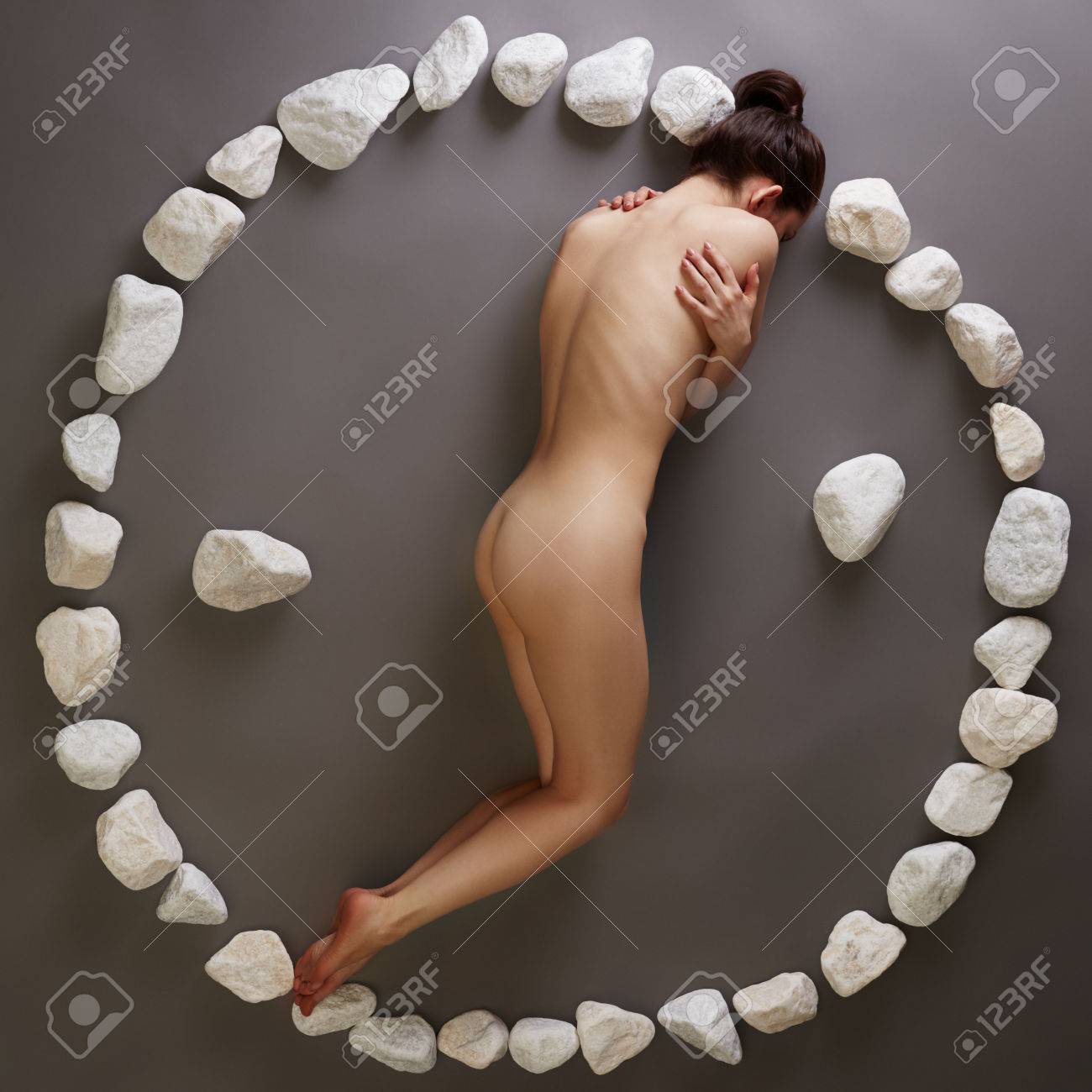 Yin-yang. Image Of Nude Woman Posing With Stones Фотография, картинки,  изображения и сток-фотография без роялти. Image 38495056
