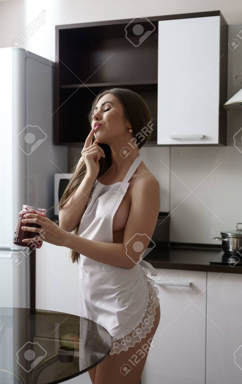 Image Of Seductive Housewife Tasting Jam In Kitchen Stock Photo, Picture  and Royalty Free Image. Image 50803917.