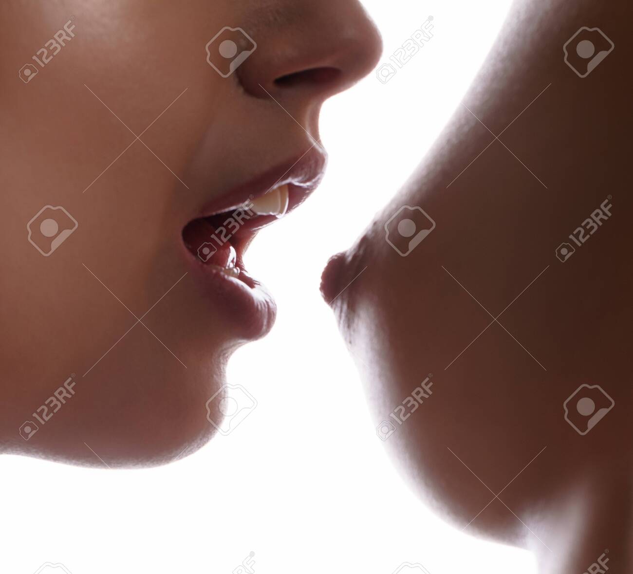 Girl Stretches Mouth To Nude Breast Of Mistress Stock Photo, Picture and  Royalty Free Image. Image 136288532.