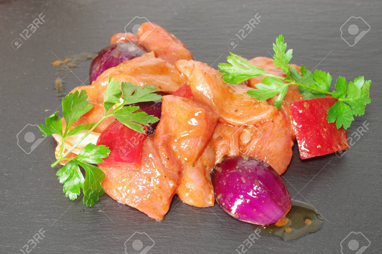 chicken meat with vegetables on stone background - 143402463 chicken meat with vegetables on stone background - 143402463