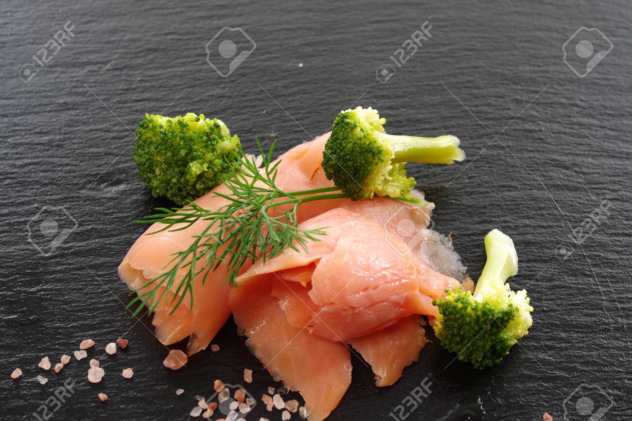 slices of smoked salmon with dill black plate background - 143402373 slices of smoked salmon with dill black plate background - 143402373