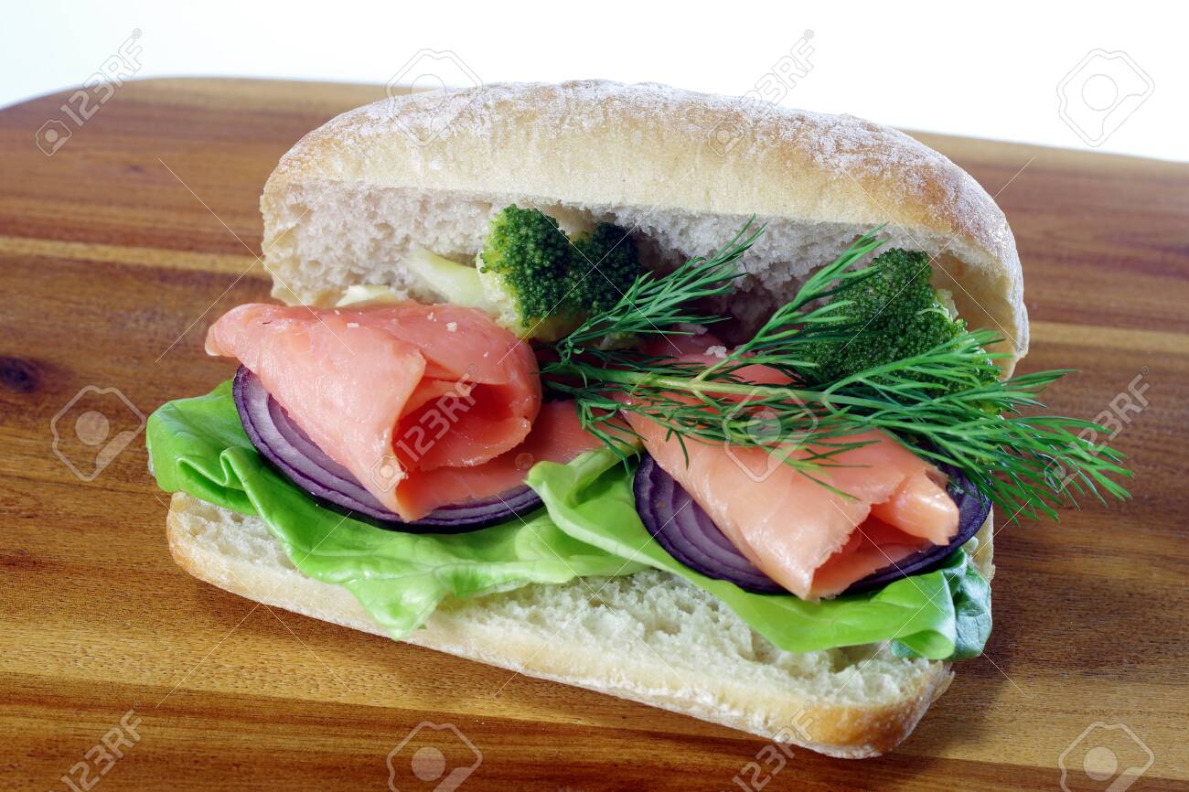 sandwich with smoked salmon on board background - 142680542 sandwich with smoked salmon on board background - 142680542