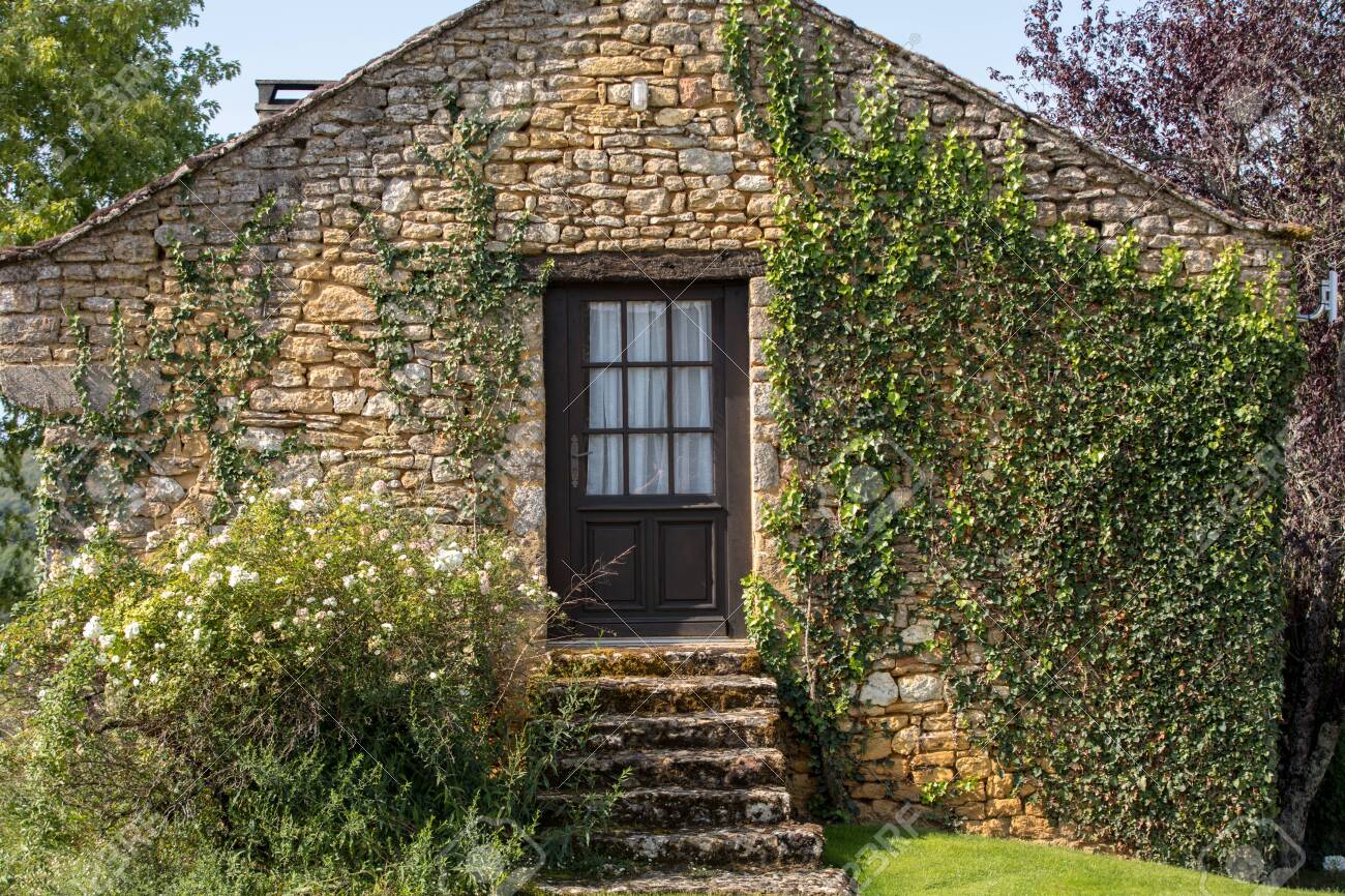 Wall Of A Old Stone House Overgrown With Ivy Stock Photo, Picture And Royalty Free Image. Image 143858798.
