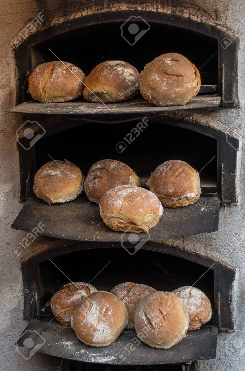 Freshly Baked Bread In A Wood Fired Stone Oven Stock Photo Picture