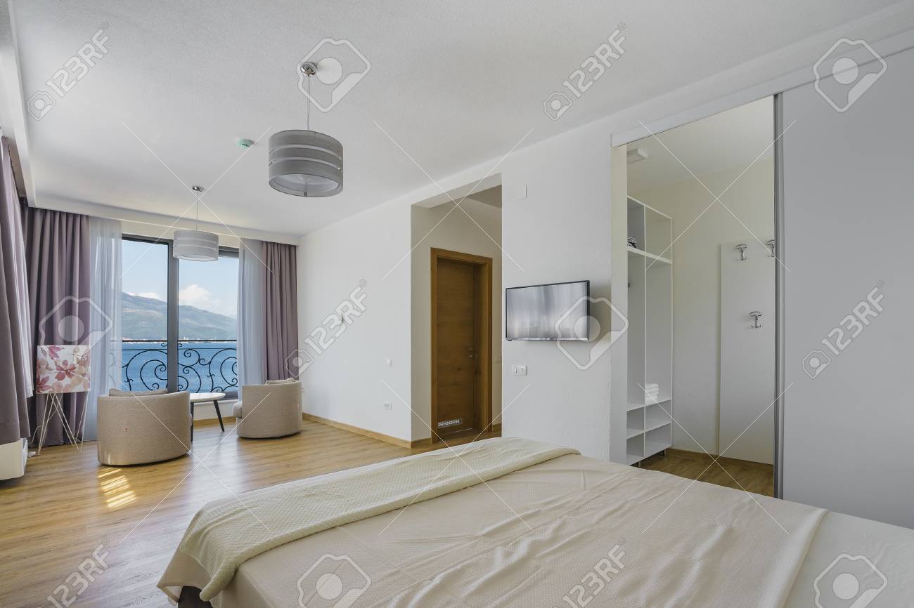 Interior Of A Spacious Light Bedroom With Sea View In A Luxury