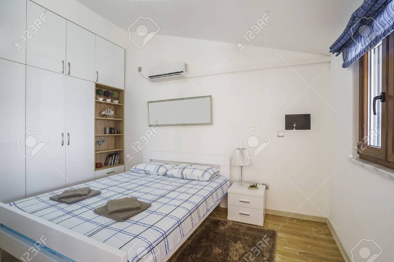 Interior Of A Modern Bedroom With Windows In A Luxury Villa