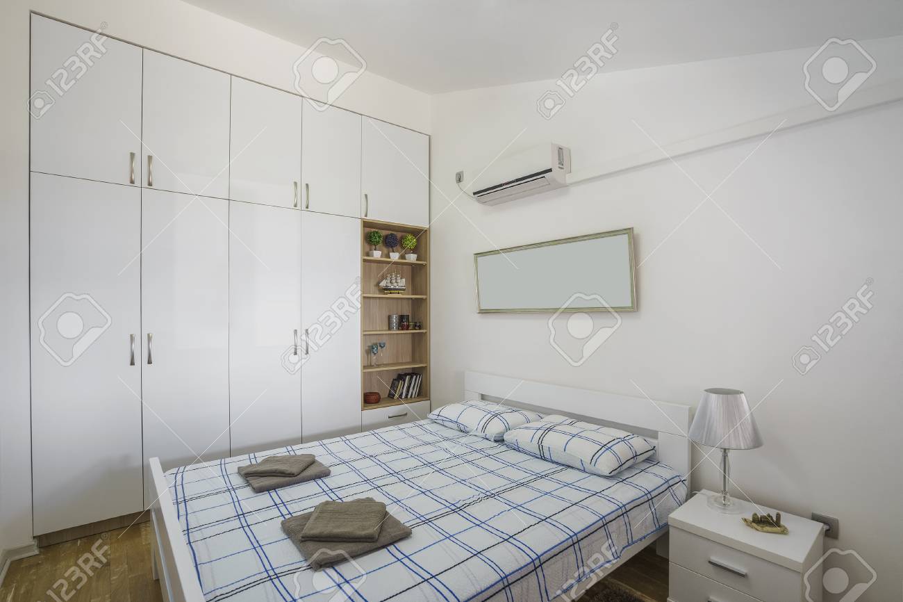 Interior Of A Modern Bedroom With Windows In A Luxury Villa