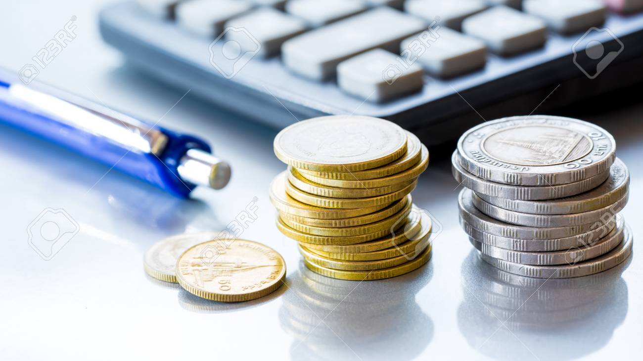 Stack of coins money with account book finance and banking concept for background.concept in grow and walk step by step for success in business - 95475401 Stack of coins money with account book finance and banking concept for background.concept in grow and walk step by step for success in business - 95475401