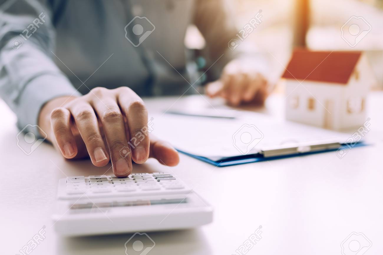 close up of finger businessman using calculator calculate budget