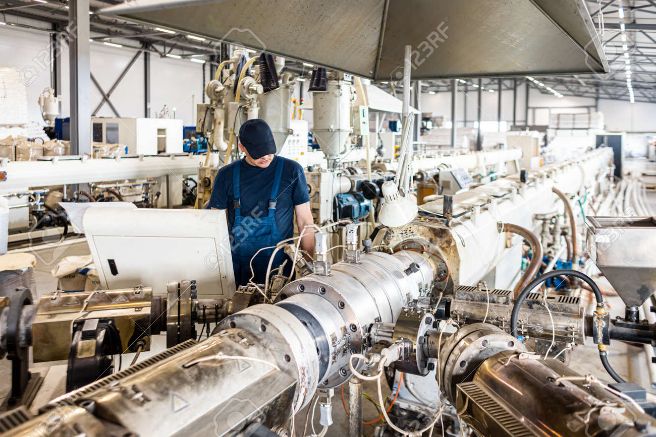 Inside factory. the interior of the equipment used in the polypropylene pipe production line - 171659705 Inside factory. the interior of the equipment used in the polypropylene pipe production line - 171659705