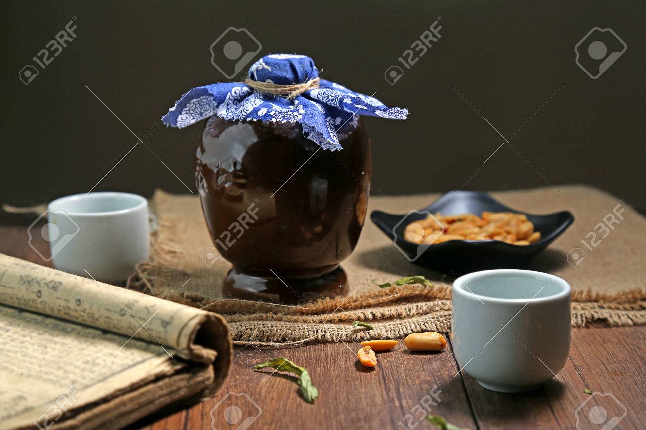 Ceramic bottle glass book placed on a wooden table - 53024246 Ceramic bottle glass book placed on a wooden table - 53024246