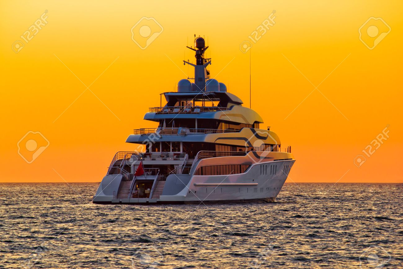 Luxury yacht on open sea at golden sunset - 15488764 Luxury yacht on open sea at golden sunset - 15488764