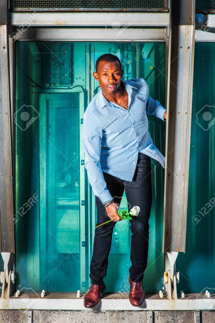 green shirt black pants white shoes