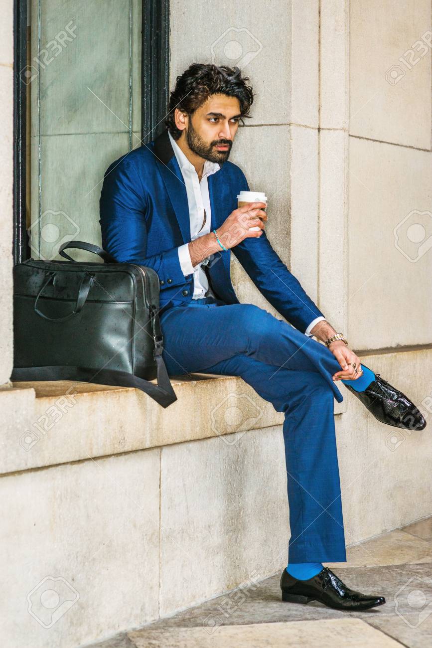 white sneakers blue suit